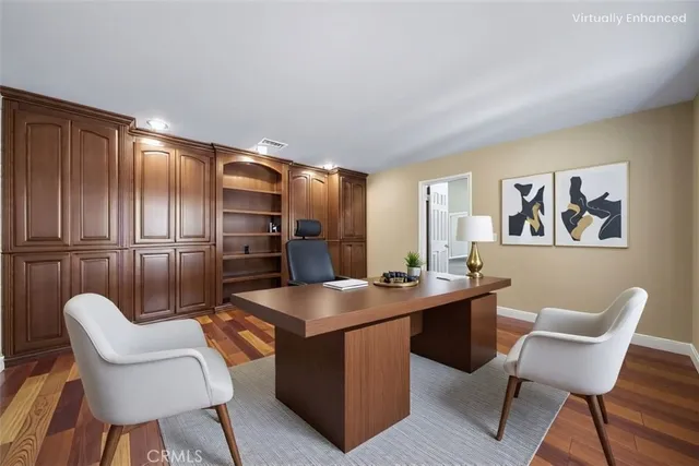 a kitchen with granite countertop a sink cabinets and stainless steel appliances