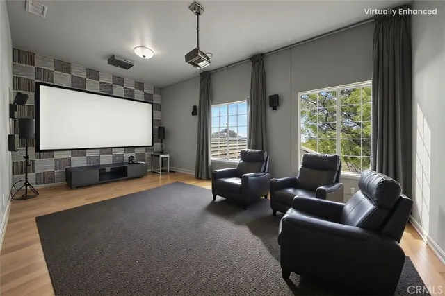 a spacious bedroom with a bed dresser and a window