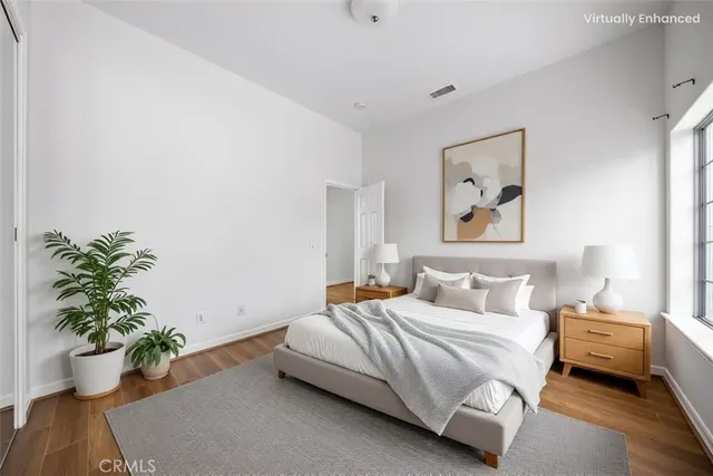 a bathroom with a granite countertop sink mirror vanity and toilet