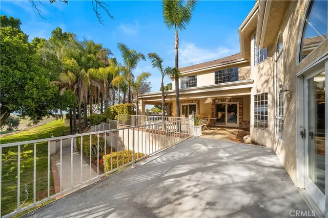 a view of a balcony with a tree