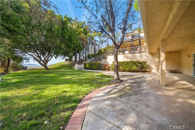 a view of a patio with table and chairs and potted plants