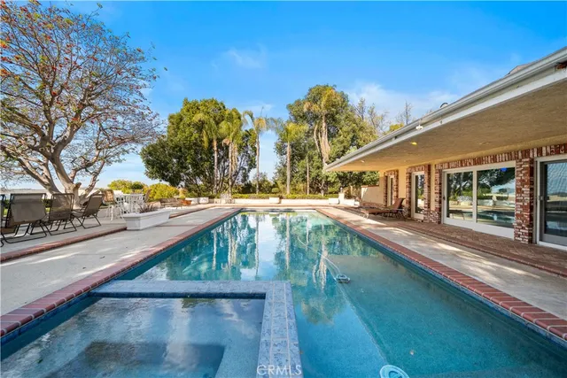 a view of swimming pool with a patio
