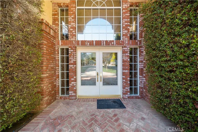 a view of a brick house with a outdoor space