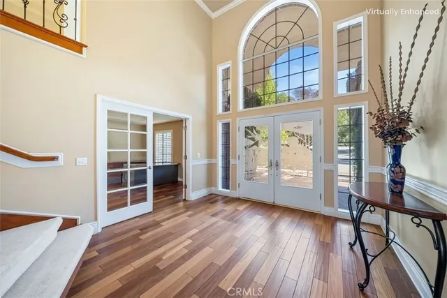 a view of a livingroom with furniture and staircase