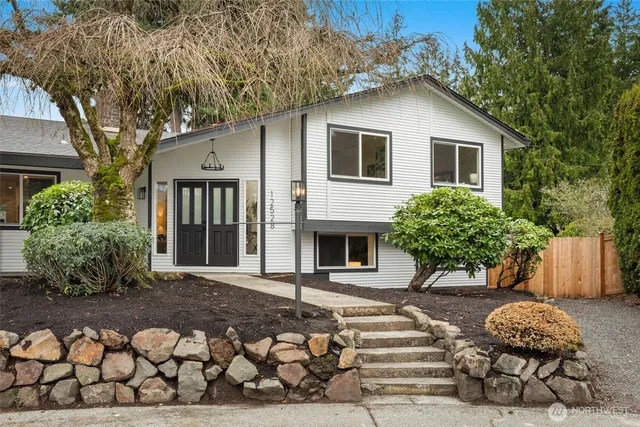 a front view of a house with garden
