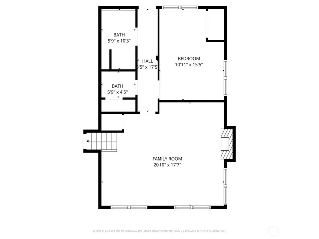 a picture of a bench in front of a wall