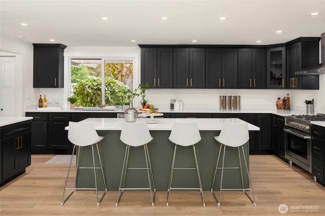 a kitchen with a sink cabinets and window