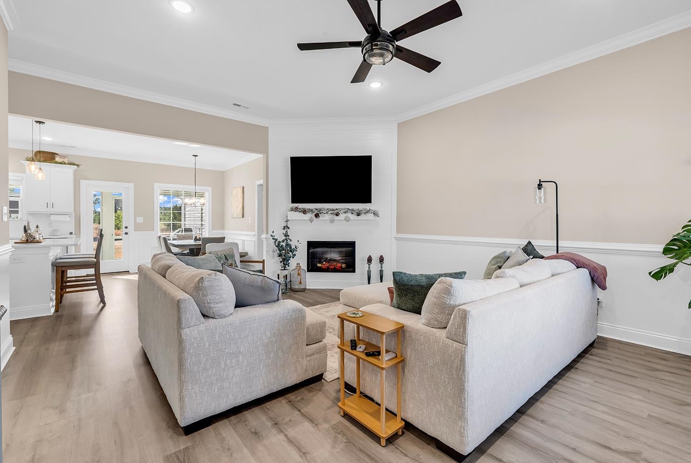 384 William Nobles Road Aynor, SC 29511 - Photo 3 of 38 Living room with ornamental molding, light wood-type flooring, recessed lighting, a large fireplace, and ceiling fan
