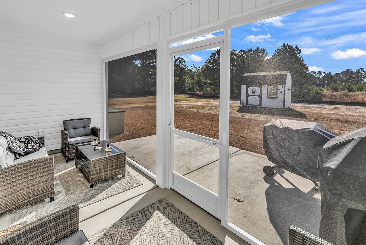 384 William Nobles Road Aynor, SC 29511 - Photo 31 of 38 Sunroom featuring an outdoor hangout area and a patio