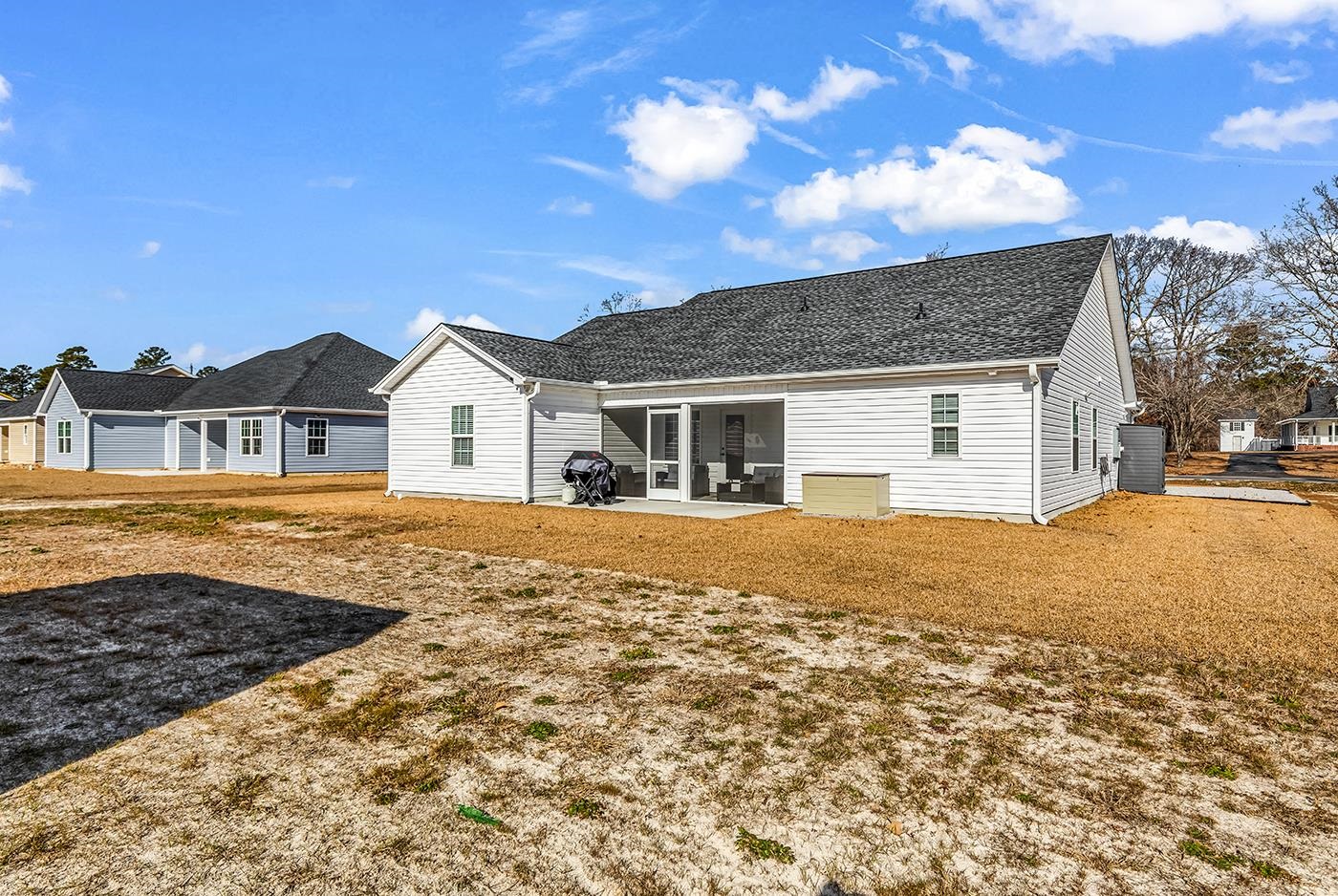 384 William Nobles Road Aynor, SC 29511 - Photo 35 of 38 Back of property with a patio and a shingled roof