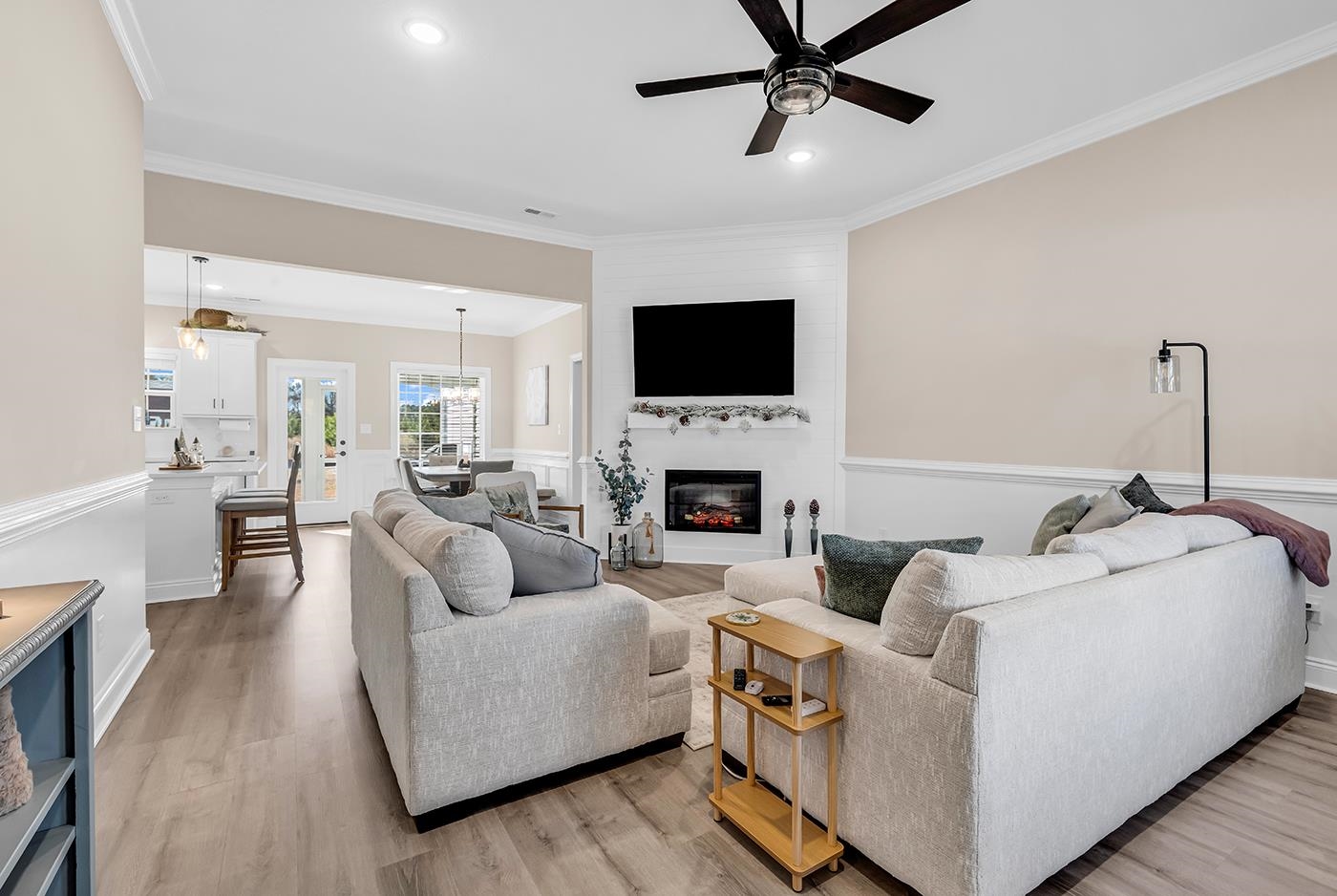 384 William Nobles Road Aynor, SC 29511 - Photo 4 of 38 Living room featuring recessed lighting, light wood-style flooring, ornamental molding, a fireplace, and a ceiling fan