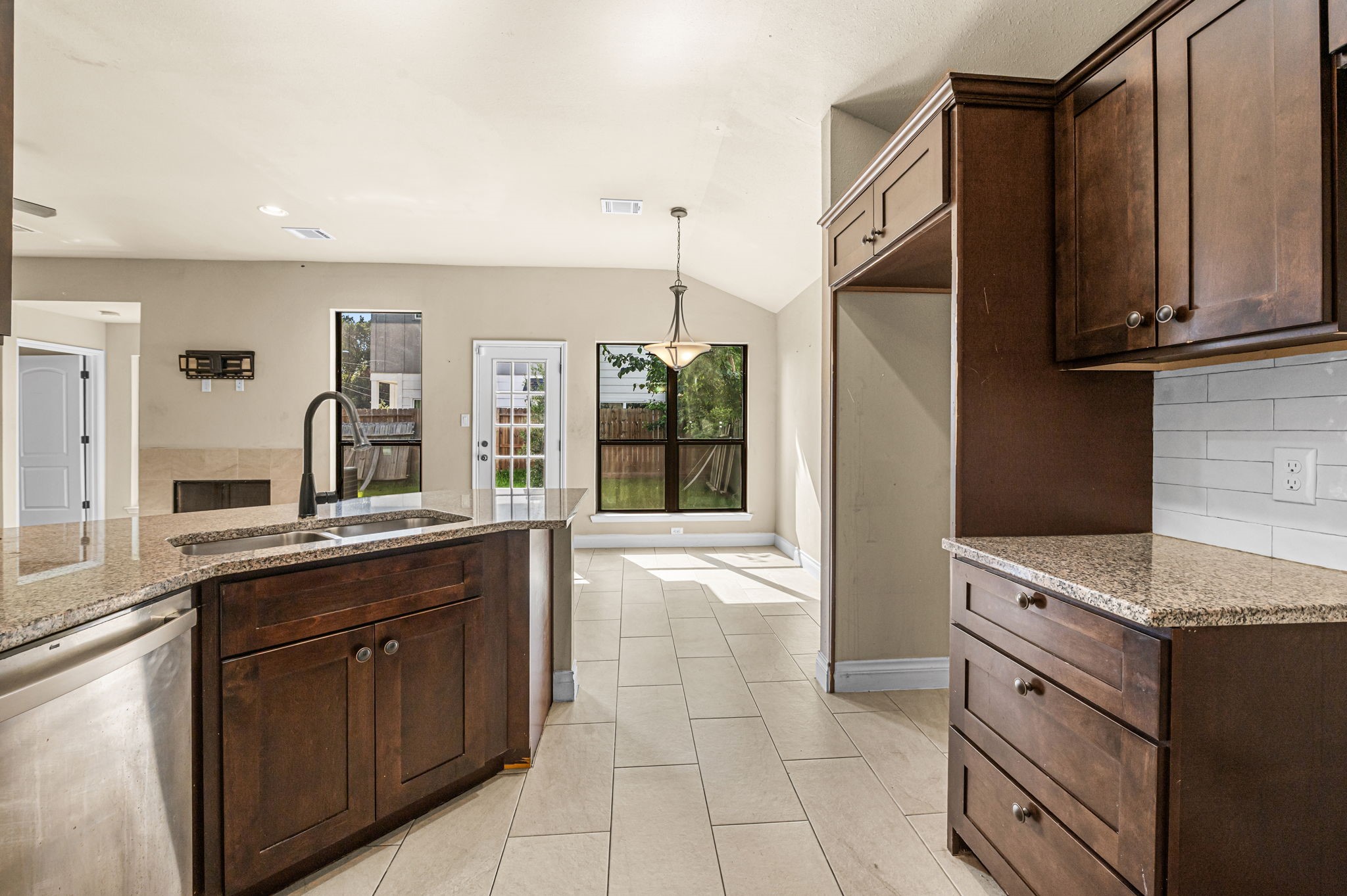 6838 Foster Street Houston, TX 77021 - Photo 10 of 24 Open kitchen overlooking the spacious living room, ideal for everyday living and entertaining