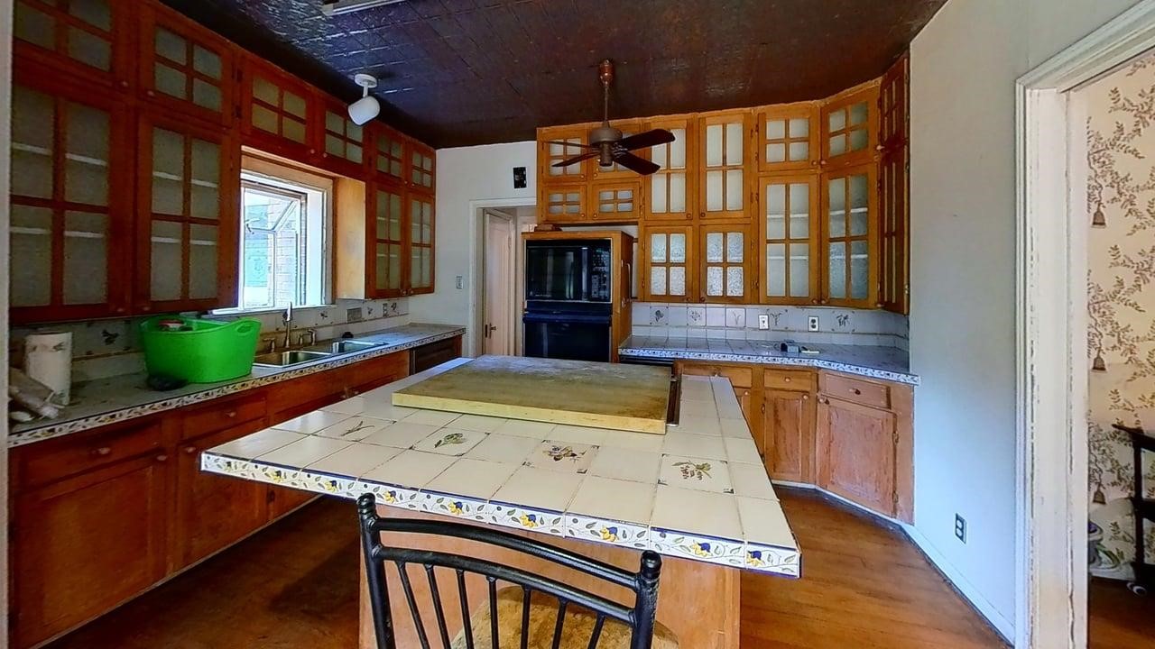 1905 Bissonnet Street Houston, TX 77005 - Photo 14 of 27 Alternate view of the Kitchen, Dining area to the right, and a pass-through to the formal living room.