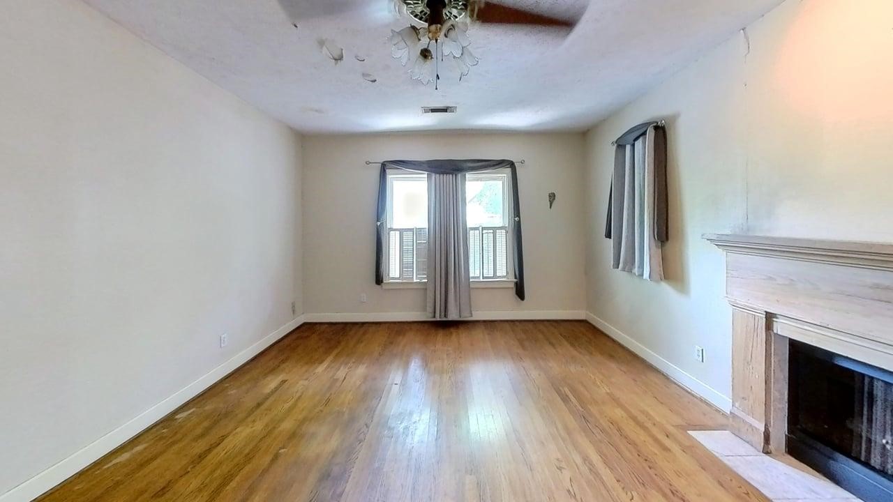 1905 Bissonnet Street Houston, TX 77005 - Photo 17 of 27 Primary Suite with fireplace overlooking the backyard.