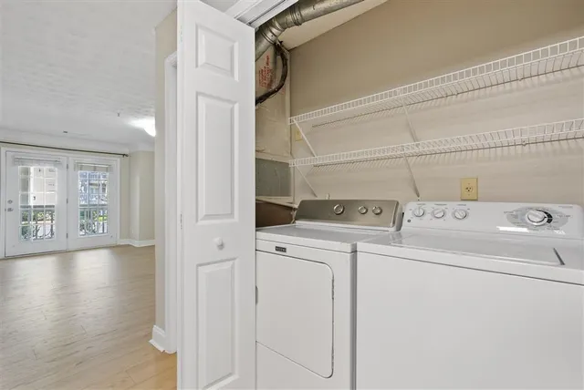 a view of storage and utility room with washer and dryer