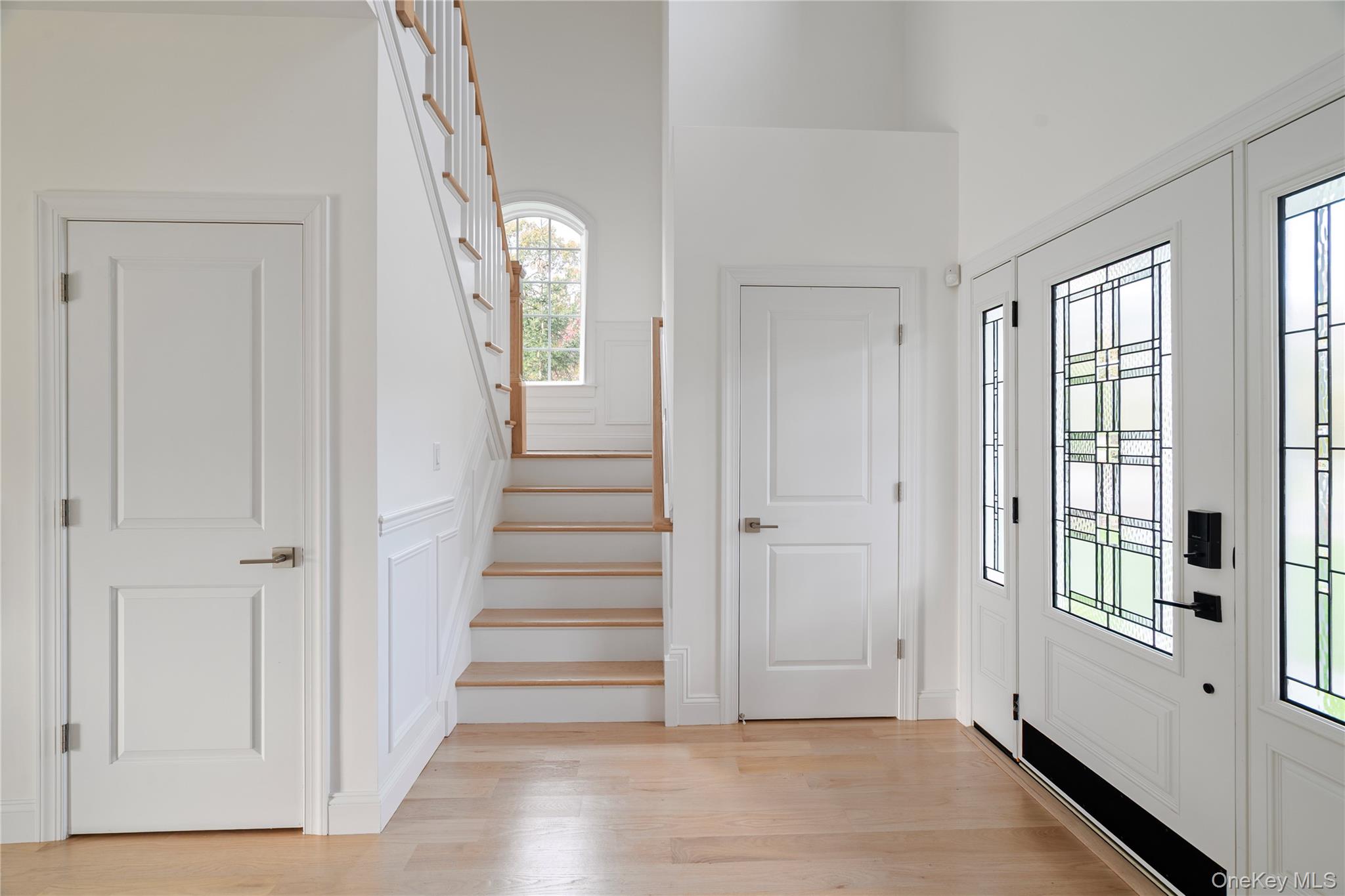 60 Parsnip Pond Road Lake Grove, NY 11755 - Photo 15 of 32 a view of a hallway with wooden floor and staircase