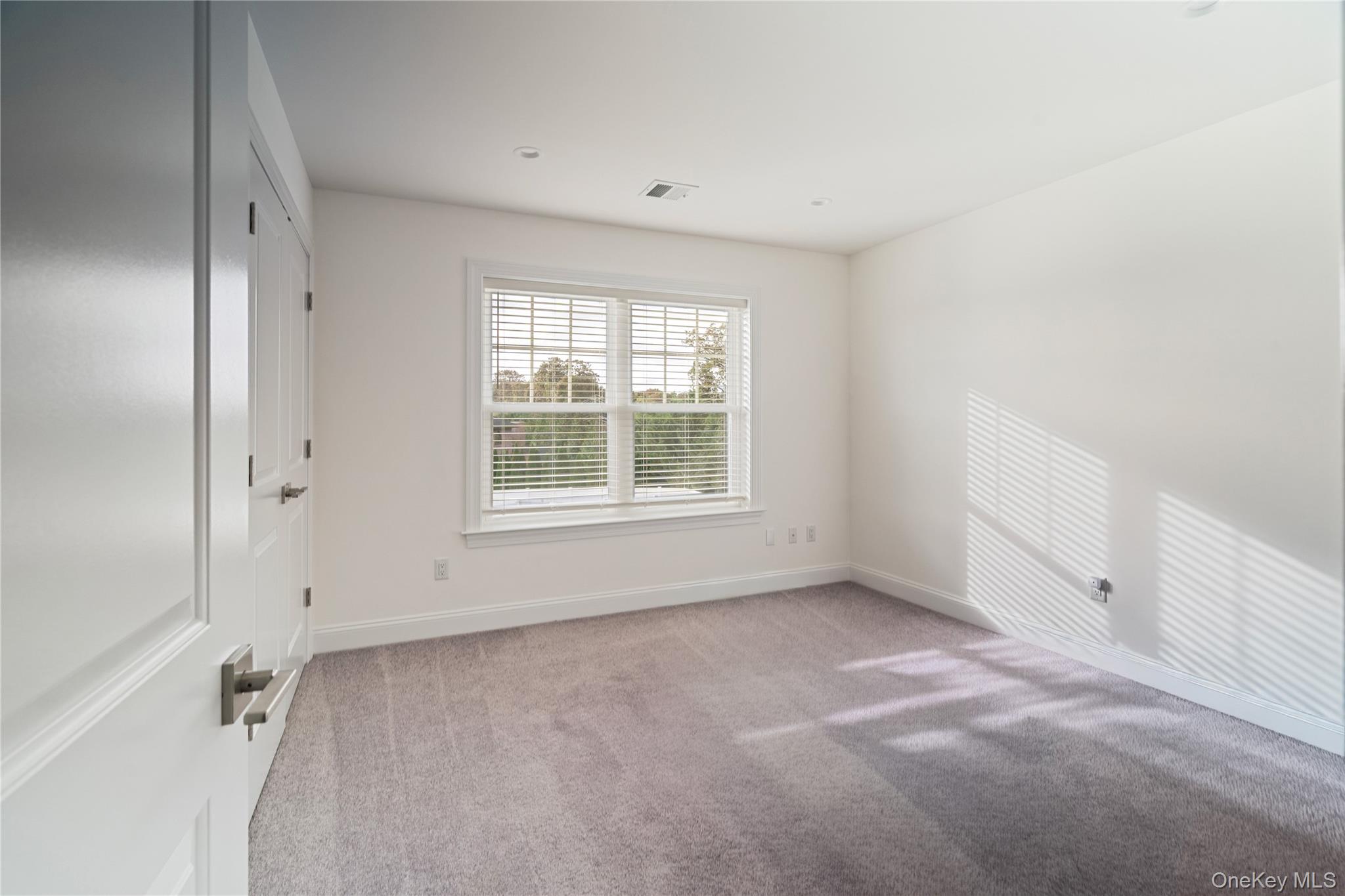 60 Parsnip Pond Road Lake Grove, NY 11755 - Photo 20 of 32 an empty room with a window