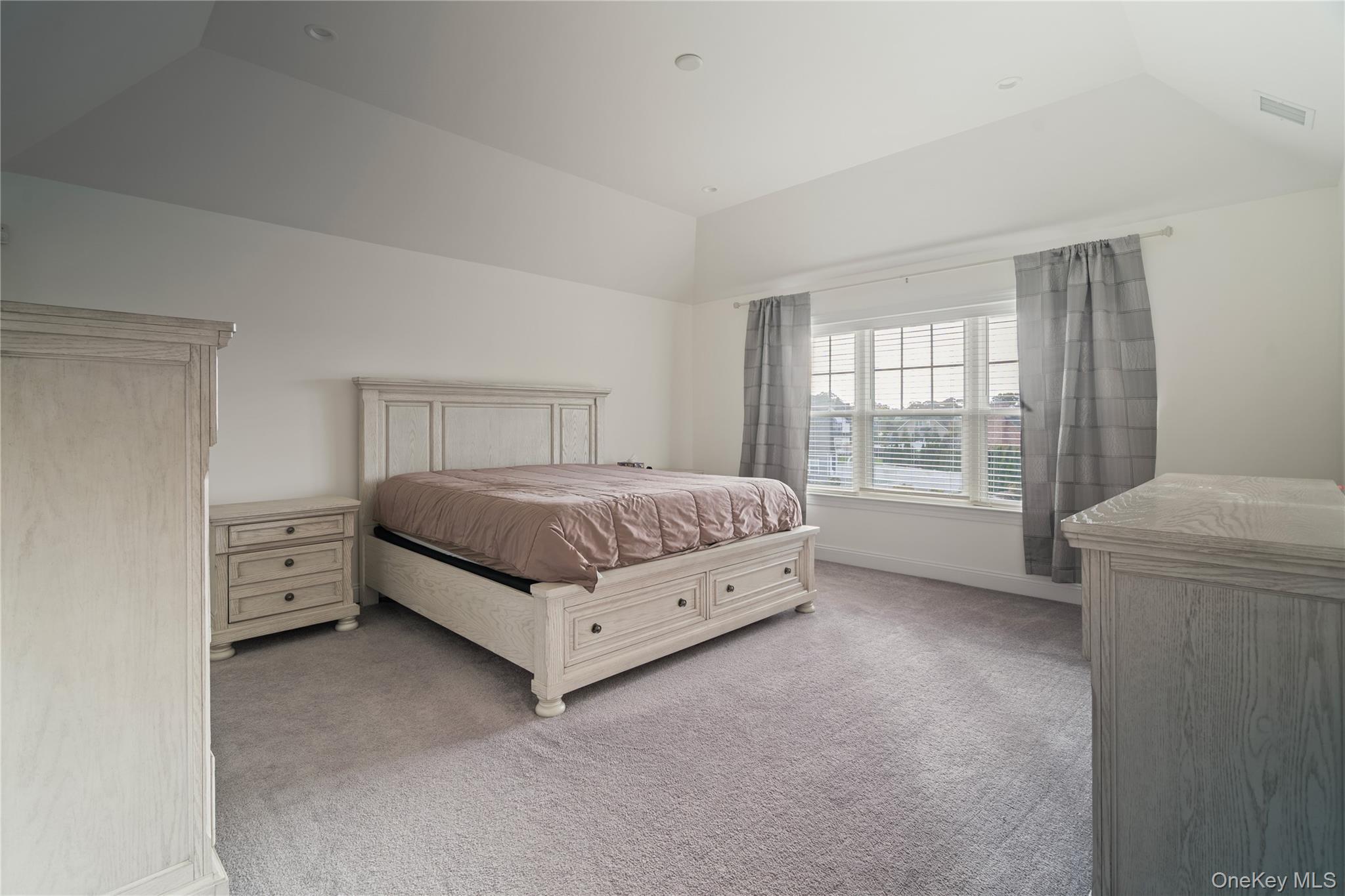 60 Parsnip Pond Road Lake Grove, NY 11755 - Photo 23 of 32 a bedroom with a bed and a window