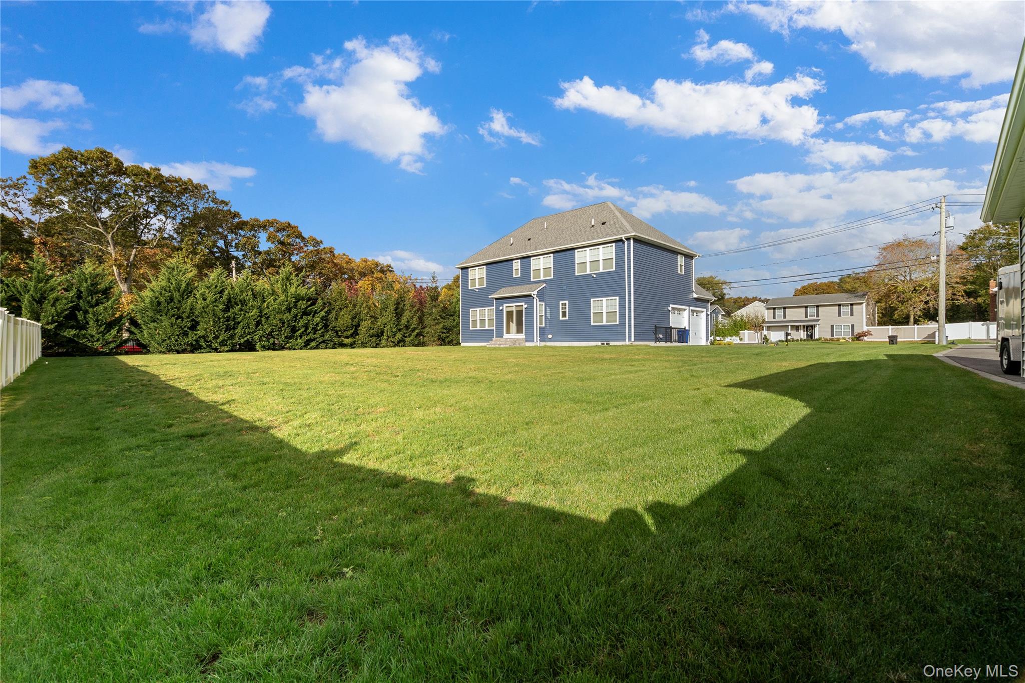 60 Parsnip Pond Road Lake Grove, NY 11755 - Photo 3 of 32 a view of a big house with a big yard
