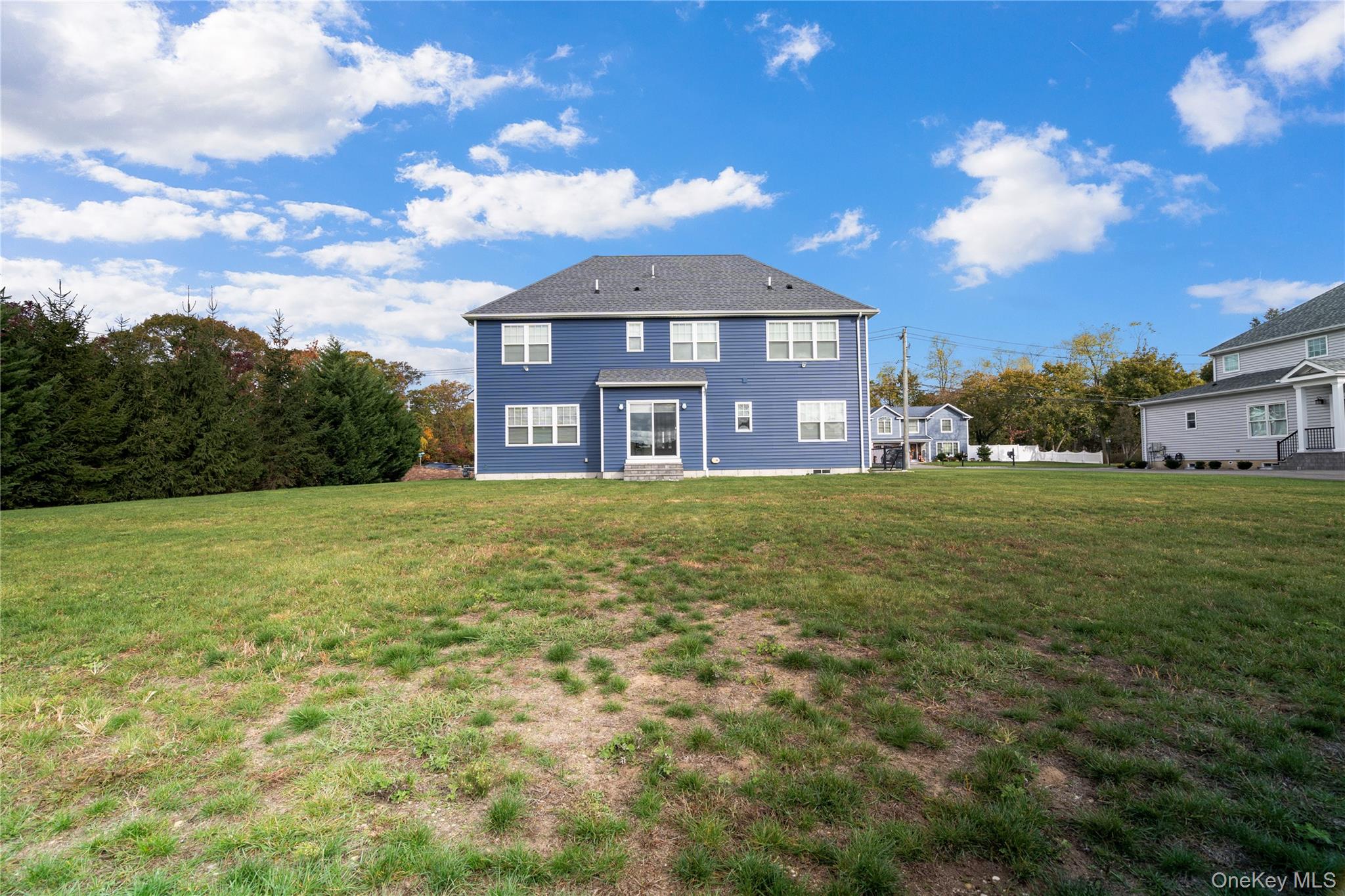 60 Parsnip Pond Road Lake Grove, NY 11755 - Photo 4 of 32 a view of a big house with a big yard