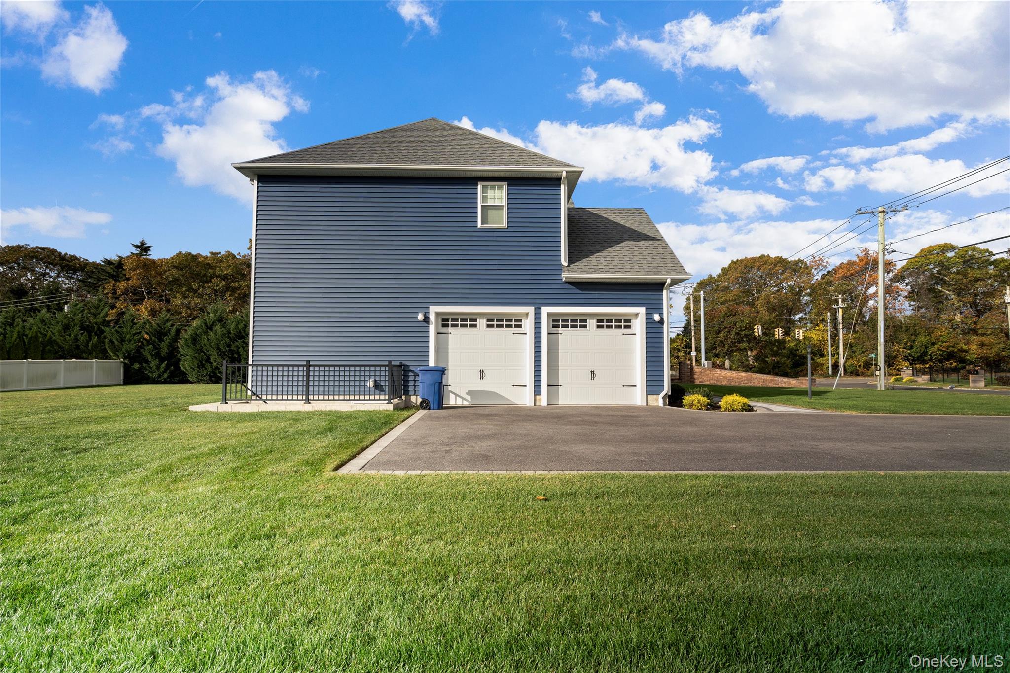 60 Parsnip Pond Road Lake Grove, NY 11755 - Photo 5 of 32 a front view of a house with a yard
