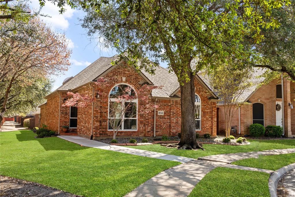 8718 Falls Road Irving, TX 75063 - Photo 2 of 28 a front view of a house with garden