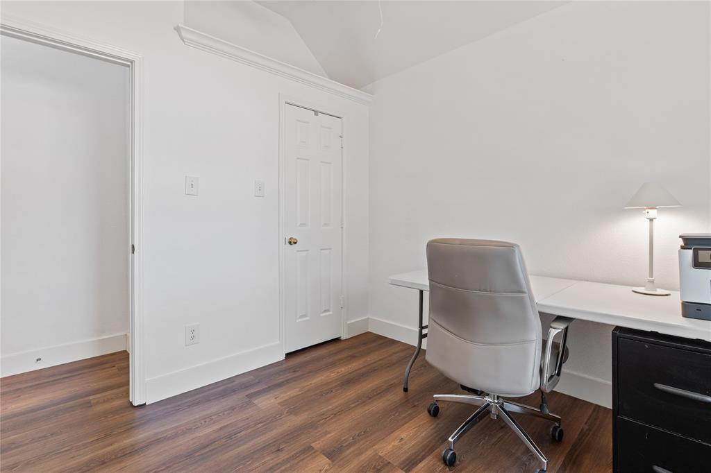 8718 Falls Road Irving, TX 75063 - Photo 23 of 28 a workspace with furniture and wooden floor