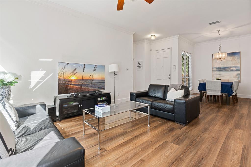 8718 Falls Road Irving, TX 75063 - Photo 3 of 28 a living room with furniture and wooden floor