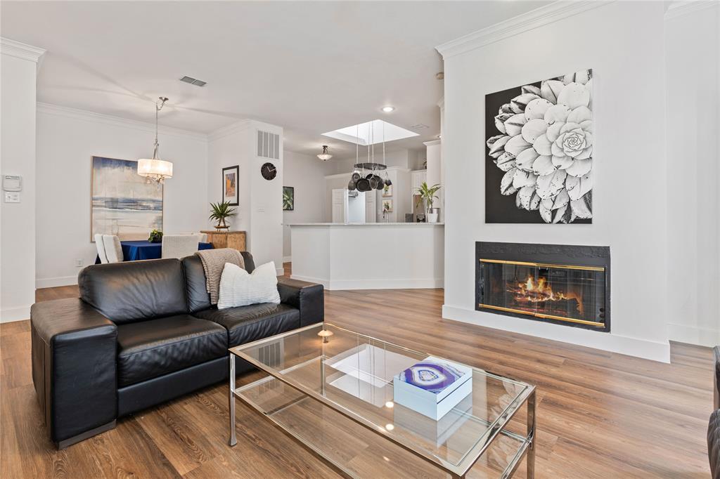 8718 Falls Road Irving, TX 75063 - Photo 6 of 28 a living room with furniture and a wooden floor