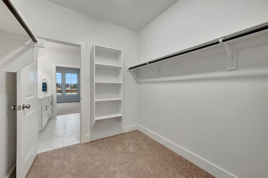 2624 Lewisville Road Celina, TX 75009 - Photo 13 of 40 a view of a walk in closet