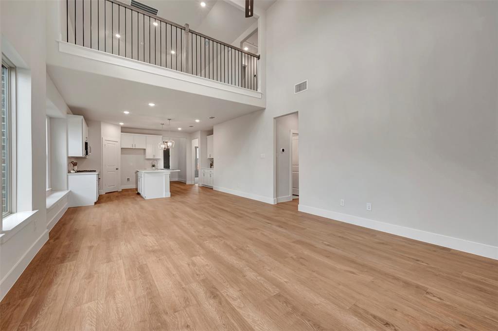 2624 Lewisville Road Celina, TX 75009 - Photo 21 of 40 a view of kitchen and hall with wooden floor