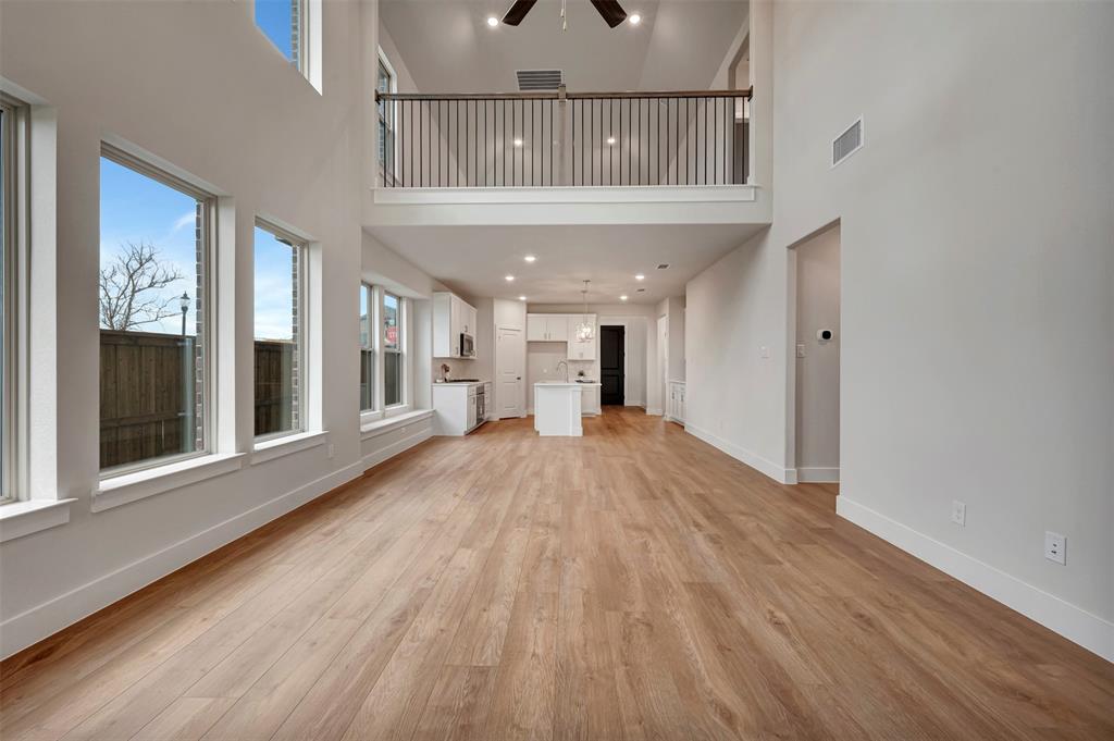 2624 Lewisville Road Celina, TX 75009 - Photo 22 of 40 wooden floor in an empty room with a window