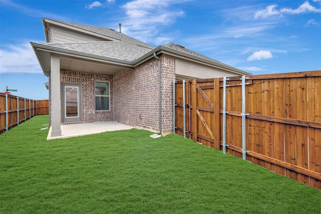 2624 Lewisville Road Celina, TX 75009 - Photo 39 of 40 a view of a backyard with wooden fence