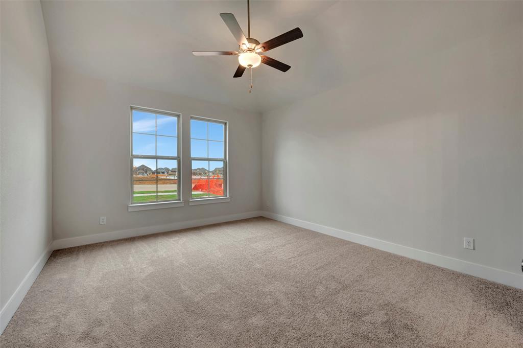 2624 Lewisville Road Celina, TX 75009 - Photo 8 of 40 an empty room with windows and fan