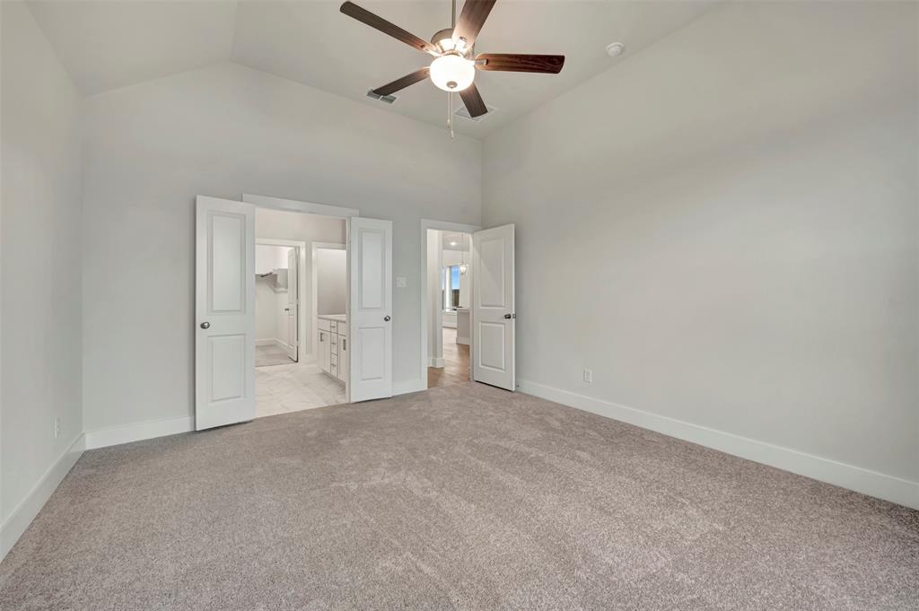 2624 Lewisville Road Celina, TX 75009 - Photo 10 of 40 an empty room with fan and entrance