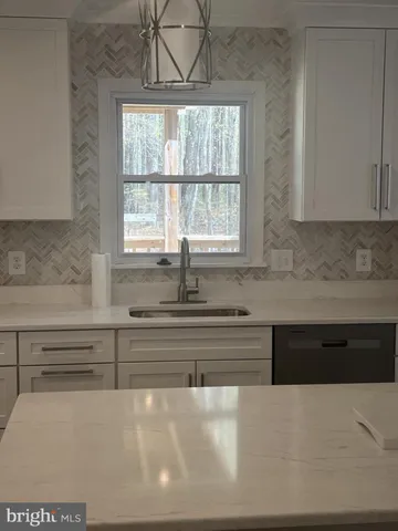 a bathroom with a bathtub and window
