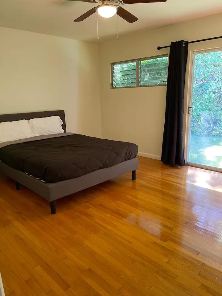 9748 Oak Pass Road Beverly Hills, CA 90210 - Photo 16 of 35 a bed sitting in a bedroom next to a window