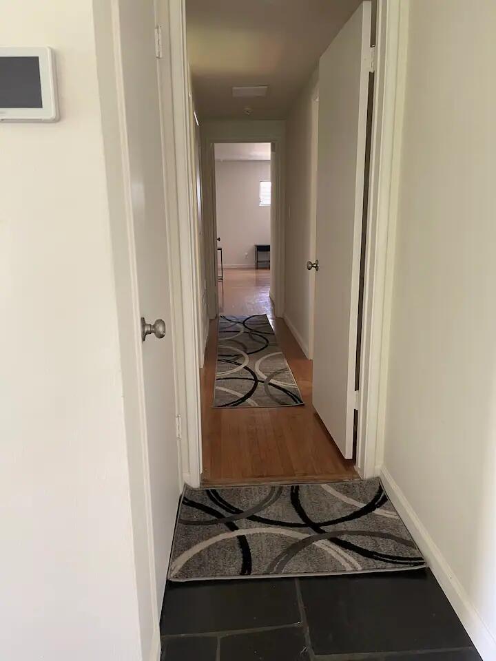 9748 Oak Pass Road Beverly Hills, CA 90210 - Photo 19 of 35 a room with table and mirror