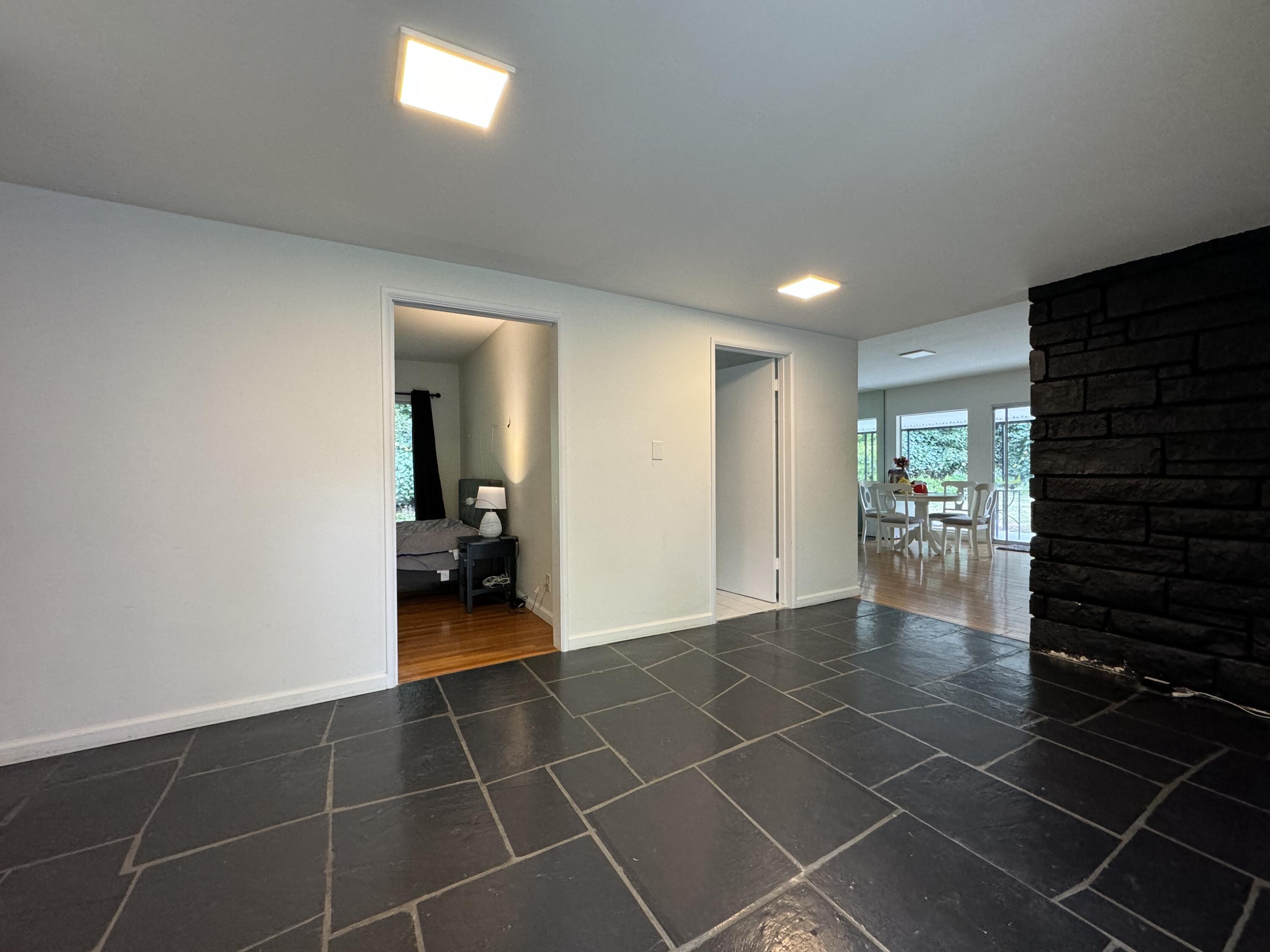 9748 Oak Pass Road Beverly Hills, CA 90210 - Photo 2 of 35 a view of a hallway and wooden floor
