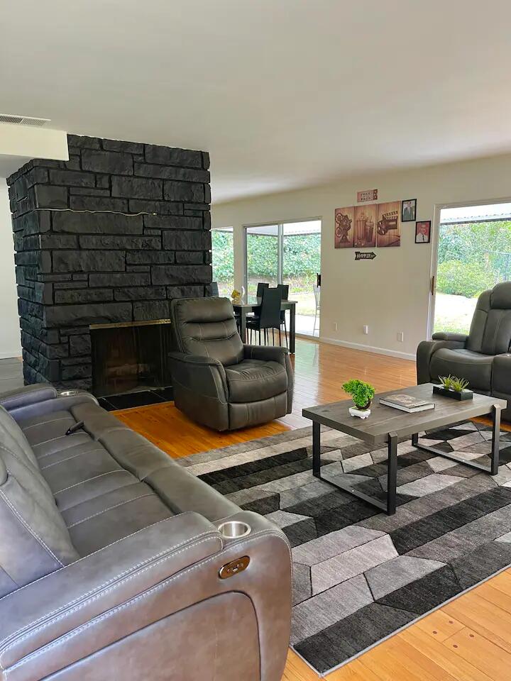 9748 Oak Pass Road Beverly Hills, CA 90210 - Photo 24 of 35 a living room with furniture and a fireplace