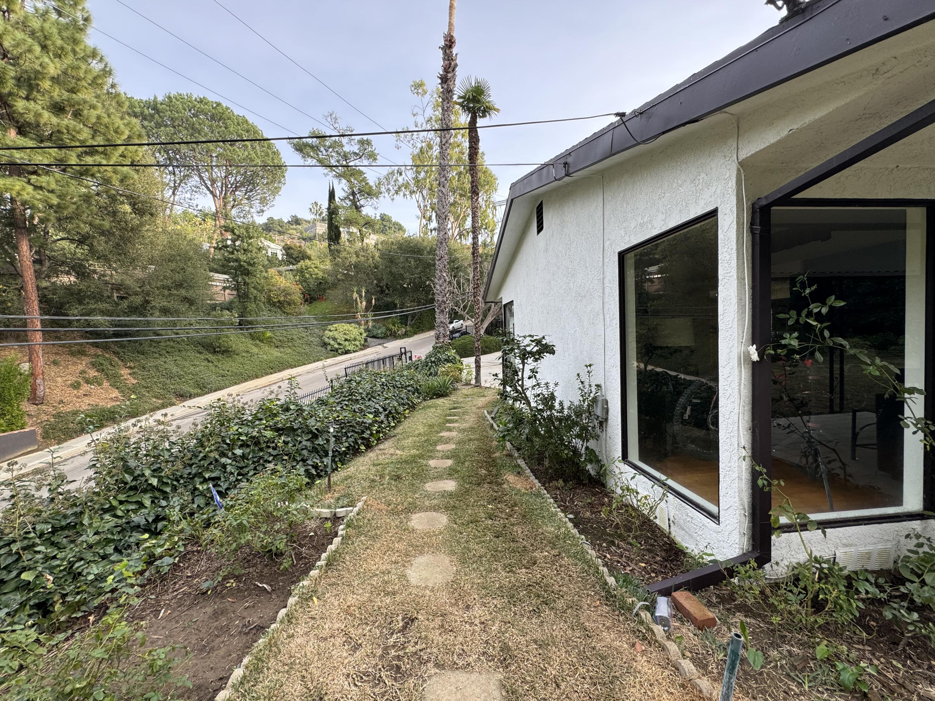 9748 Oak Pass Road Beverly Hills, CA 90210 - Photo 35 of 35 a view of a pathway in front of house