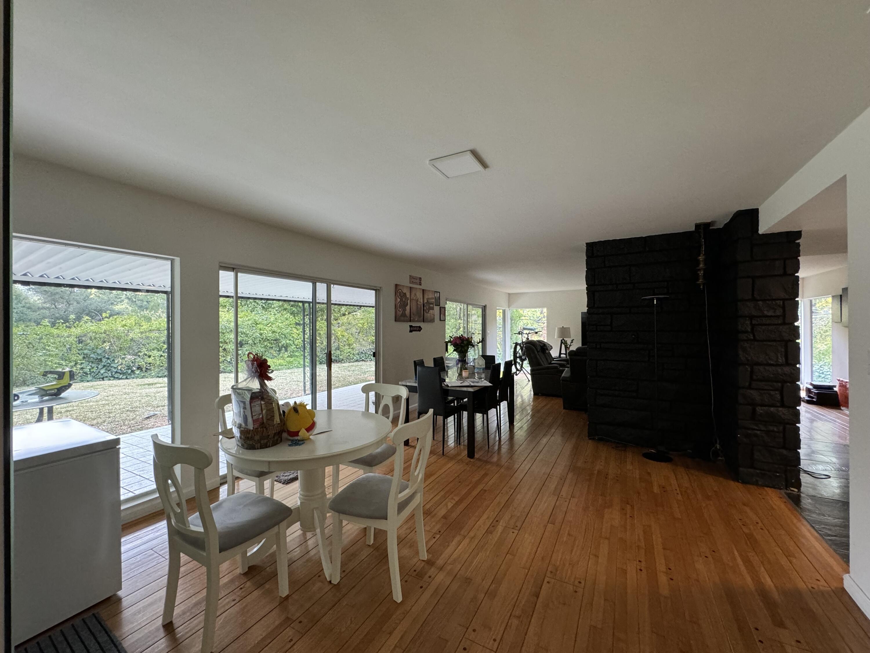 9748 Oak Pass Road Beverly Hills, CA 90210 - Photo 9 of 35 a view of a dining room with furniture window and outside view