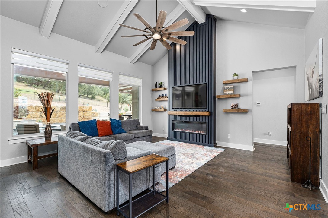 5943 Colin Ridge New Braunfels, TX 78132 - Photo 17 of 37 a living room with furniture and a flat screen tv