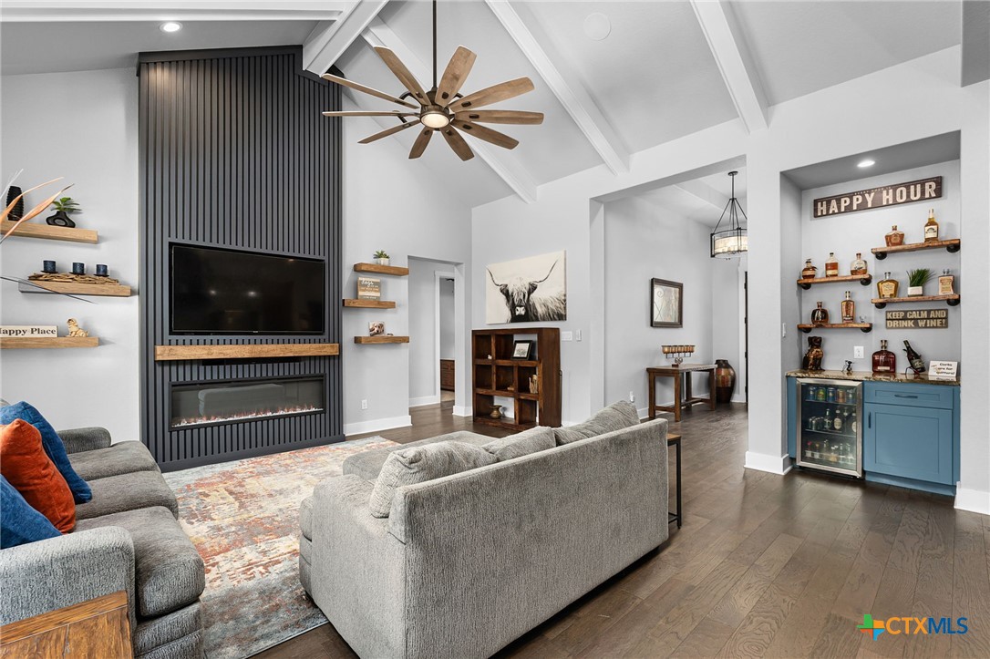 5943 Colin Ridge New Braunfels, TX 78132 - Photo 18 of 37 a living room with furniture and a flat screen tv