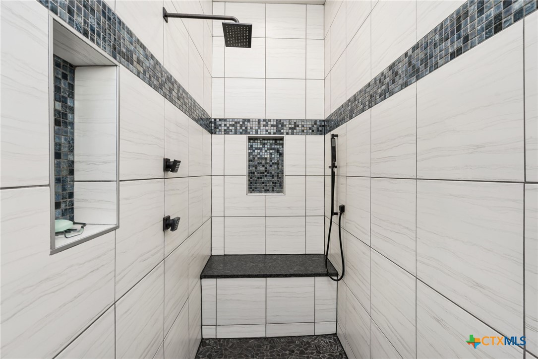 5943 Colin Ridge New Braunfels, TX 78132 - Photo 27 of 37 a bathroom with a shower