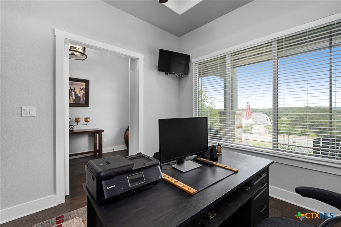 5943 Colin Ridge New Braunfels, TX 78132 - Photo 34 of 37 a view of a workspace with furniture and a window
