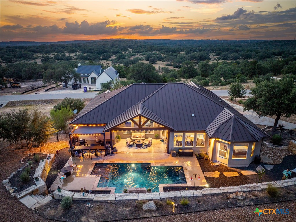 5943 Colin Ridge New Braunfels, TX 78132 - Photo 4 of 37 a view of a swimming pool with a patio