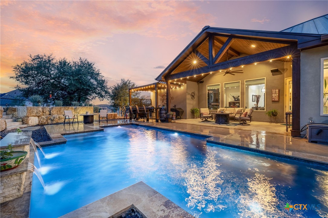 5943 Colin Ridge New Braunfels, TX 78132 - Photo 5 of 37 a view of a living room and kitchen