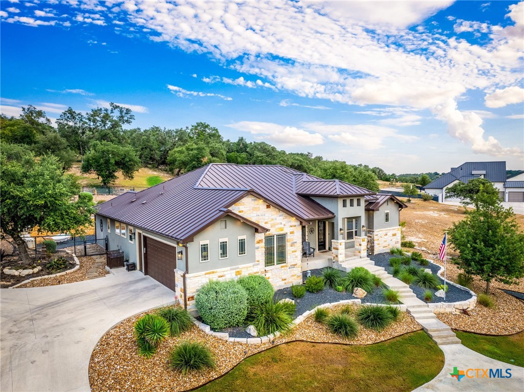 5943 Colin Ridge New Braunfels, TX 78132 - Photo 7 of 37 a view of a house with a yard and balcony
