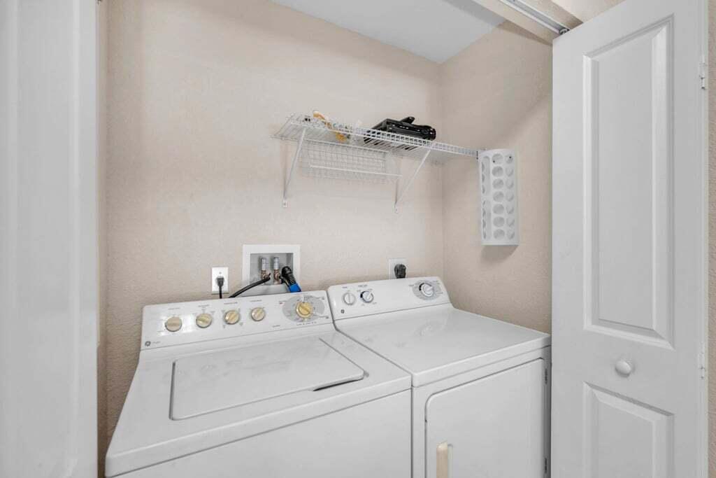 1690 Renaissance Commons Boulevard, Unit 1219 Boynton Beach, FL 33426 - Photo 14 of 38 a utility room with dryer and washer